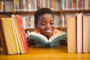 Image of child reading a book.